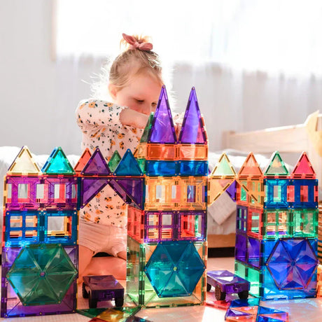 A Girl playing with Connetix Magnetic Tiles in a Castle Formation